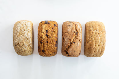 Mixed bundle of organic gluten-free sourdough loaves including Classic, Cinnamon Raisin, and Rosemary and Olive Oil from Leaven and Love Organic Bakehouse