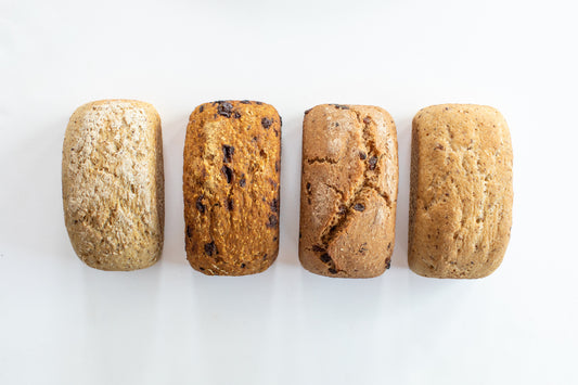 Mixed bundle of organic gluten-free sourdough loaves including Classic, Cinnamon Raisin, and Rosemary and Olive Oil from Leaven and Love Organic Bakehouse